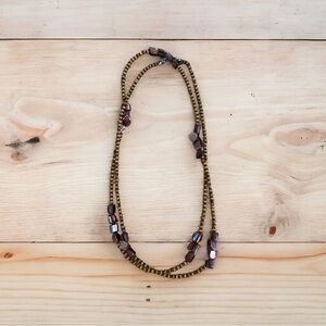 Long shell and wooden bead necklace.